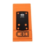 C&H PLT FOR GLK 43X MOS TO HOLO EPS, top view of black plate with holes on orange packaging
