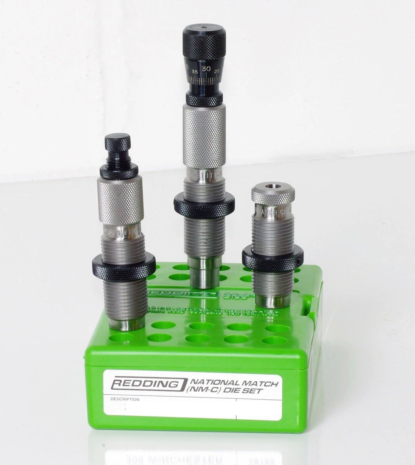 redding-type-s-match-bushing-neck-die-set-223-valkyrie-primary-1 Redding Type S-Match Bushing Neck Die Set, three silver dies standing in a bright green case