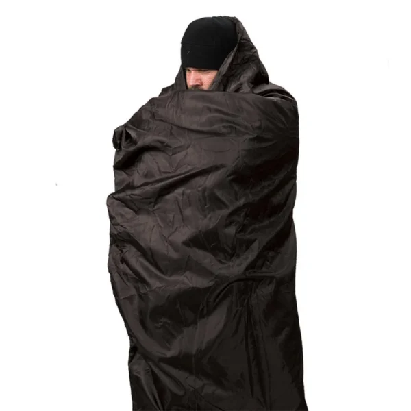 Snugpak Jungle Blanket WGTE, black blanket wrapped around a standing person