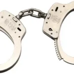 Smith & Wesson S&W 100 handcuffs, nickel finish with both cuffs open in front view