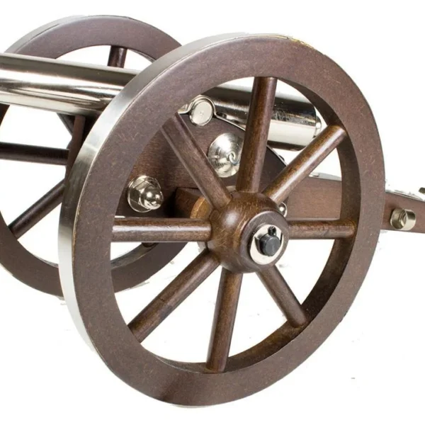 Traditions Mini Napoleon III Cannon, angled side view with metal barrel and brown spoked wheels