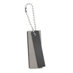 UST MAGNESIUM FIRESTARTER gray rectangular fire starter with serrated edge and ball chain