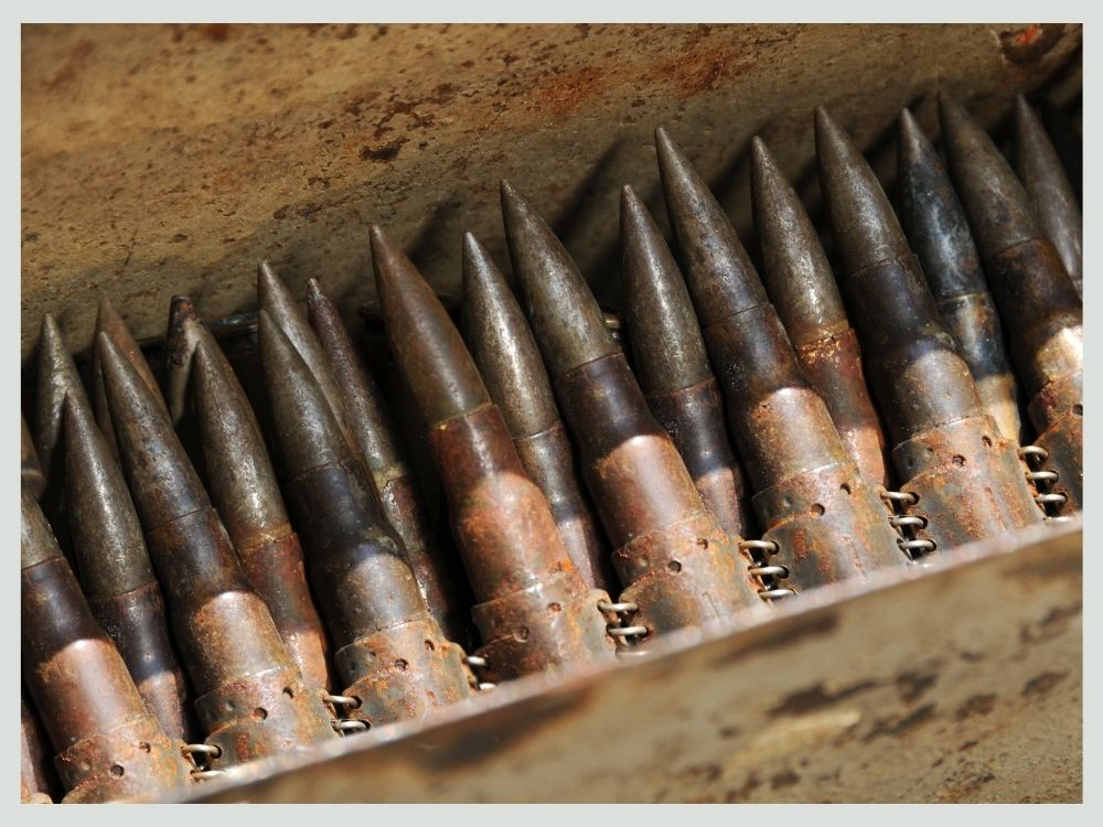 Factory ammunition boxes stored inside a sealed metal ammunition can