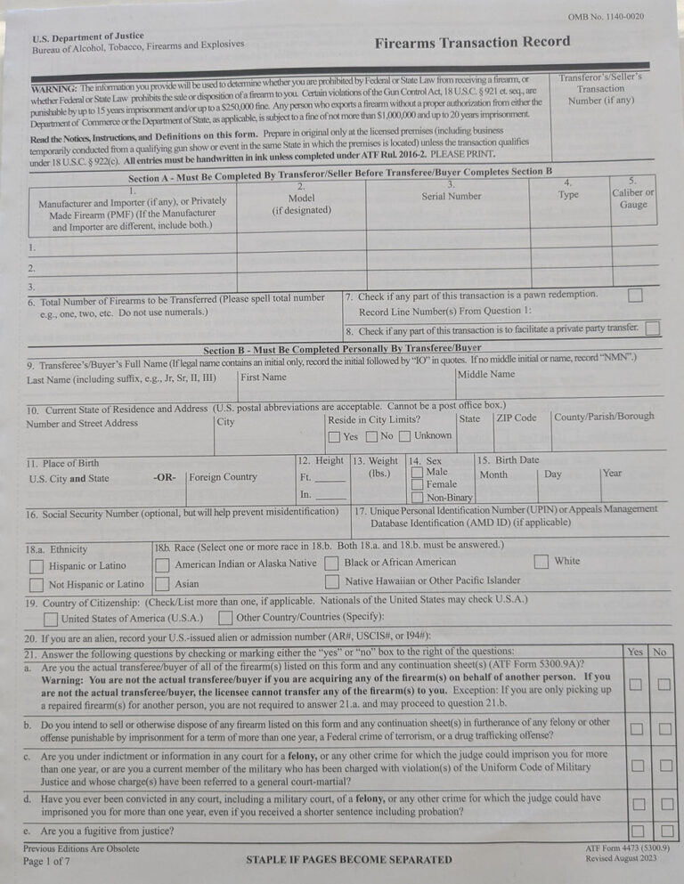 Firearms dealer reviewing transfer paperwork beside a secured handgun at the counter