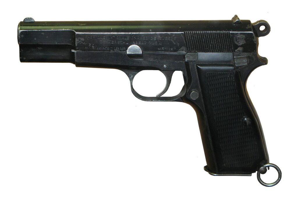 semi-automatic pistol with FRT trigger kit parts on mat
