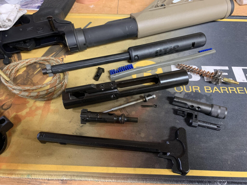 Shotgun cleaning kit with rod brushes patches and firearm lubricant